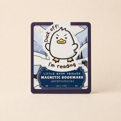 A square magnetic bookmark for children, featuring a cartoon penguin character and the text 'Duck off! I'm reading'. The bookmark has a dark navy border and a blue lower section with white text reading 'LITTLE BOOK FRIENDS MAGNETIC BOOKMARK' and the brand '@SOCIETY_OF_BOOKS'.